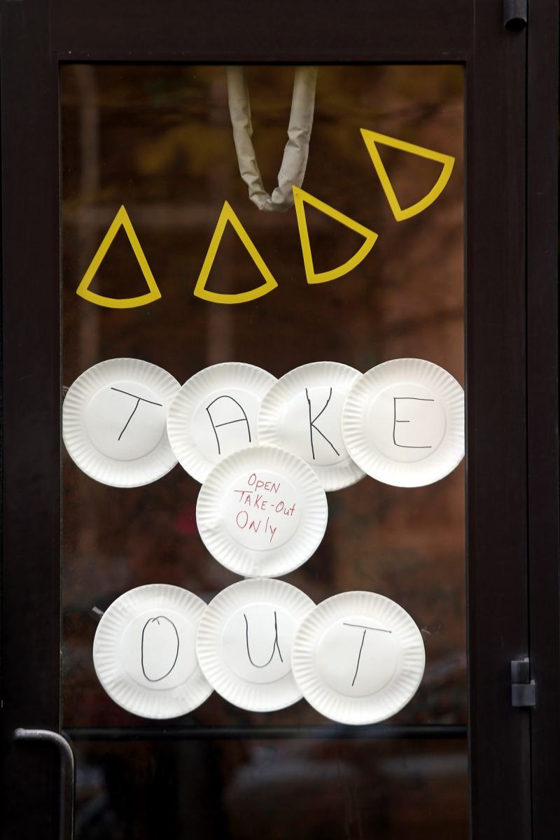 A sign in the window of Benny Capitale's Pizza in downtown Raleigh.March 20, 2020. Raleigh, NC