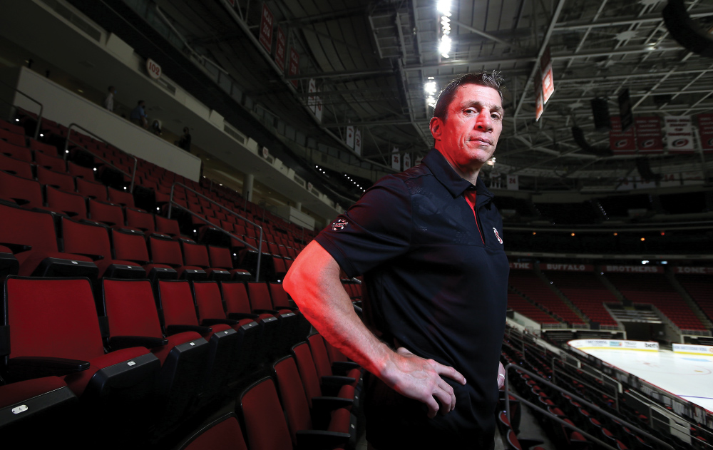 Rod Brind'Amour, a former Philadelphia Flyers player and current Carolina  Hurricanes assistant coach pauses during a ceremony inducting him into the  Flyer's Hall of Fame before an NHL hockey game between the